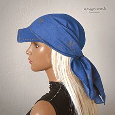 a mannequin head wearing a blue bandana