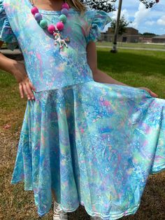 Paint splatter twirl dress. Flutter sleeves, crossback, huge twirl. Super soft and comfy. Stretchy waist band. Modest cut perfect for every occasion