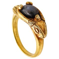 Ancient revival ring with a ram. This is a very unusual and beautiful ring designed in the 19th century with a mix of ancient Etruscan and Egyptian revival patterns. The ring is of European origin and most probably made in England during the middle of the Victorian era, back in the 1860. The ring has been crafted in one solid piece of rich yellow gold of 22 karats with the stylized head of a male-ram with very long horns. The ring is very well executed with nice details of the sculpted ram's hea Stylized Head, Ancient Rings, Long Horns, Grey Sapphire, Vintage Cocktail Ring, Egyptian Revival, Onyx Jewelry, Special Ring, Wax Casting