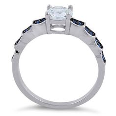 Top of ring height: 5.7mm

Top of ring width: 6mm

Band width: 3.2mm

Shank width: 1.9mm


Stone material: blue & clear cubic zirconia

Center stone size: 6mm

Stone shape: round

Center stone carat weight: .84 ct.

Total number of CZ stones: 33

Stone setting: prong setting


Metal: 925 sterling silver

Plating: rhodium plated

Finish: high polish Stone Setting, Cz Ring, Cz Stone, Stone Settings, Sterling Ring, Rhodium Plated, Prong Setting, Beautiful Rings, Round Cut