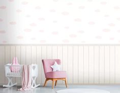 a baby's room with pink furniture and wallpaper in pastel tones, including a crib