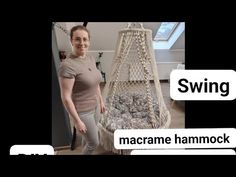 a woman standing next to a hammock filled with balls