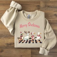 Embrace the holiday spirit with our Christmas Ducks Sweatshirt, featuring a playful design that makes it a standout piece. This Funny Animals Christmas Sweatshirt is perfect for anyone who loves quirky, festive apparel. Ideal for those who appreciate a touch of humor, our Duck Sweatshirt adds a fun twist to your Christmas celebrations and is a great gift for anyone who enjoys unique holiday fashion. Celebrate the season with our Farm Lover Gift, featuring a delightful Christmas Animals Duck Swea Duck Sweatshirt, Duck Christmas, Christmas Duck, Christmas Shirt Funny, Animals Christmas, Christmas Animals, Holiday Design, Unique Christmas, Holiday Fashion