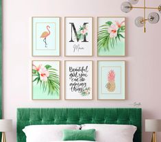 a bedroom with pink walls, green headboard and pictures on the wall above it