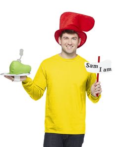 a man in a yellow shirt and red hat holding a sign that says sam i am