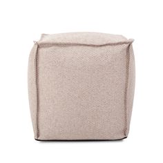 a small square ottoman in beige fabric