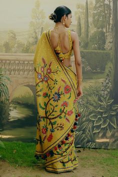 Yellow saree featuring sequin detailing with floral kalamkari print. Paired with a aari, resham and zardozi hand embroidered padded blouse. - Aza Fashions