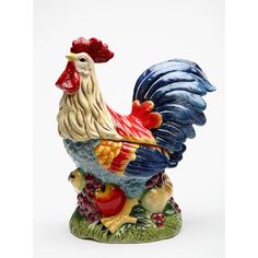 a figurine of a rooster is shown on a white background