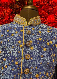 A regal blue sherwani adorned with intricate floral embroidery in gold and silver tones. The high-collared design and detailed buttons exude sophistication, making it perfect for weddings and grand celebrations. The luxurious fabric and rich embroidery make this sherwani a statement piece for any groom or special occasion. Key Features: Color: Royal blue with gold and silver floral embroidery. Design: High-collared with ornate buttons. Fabric: Rich, textured fabric for a luxurious feel. Occasion Buy Lehenga Online, Indian Bridal Couture, Blue Sherwani, Weddings Elegant, Elegant Veils, Reception Gowns, Mehendi Outfits, Bridal Store, Bridal Lehenga Red