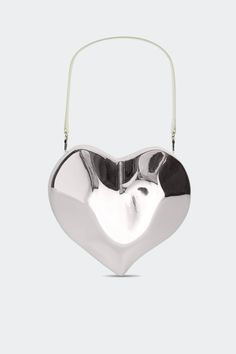 Abstract resin heart shaped bag with custom hardware. The vegan leather strap and chain strap are both detachable providing versatility. This statement piece blends artistry with functionality. Vegan leather lined. Details Model #: S1005-9162-45002 100% RESIN Imported Sizing Height: 24Inches Length: 26inches Depth: 6in Heart Shaped Bag, Heart Bag, Moon Shapes, Silver Moon, Arm Candy, Chain Strap, Lifestyle Brands, Vegan Leather, Leather Straps