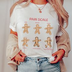 a woman wearing a t - shirt that says pain scale with gingers on it