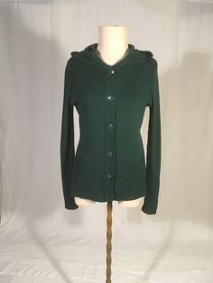 "vintage 1970s button up hooded sweater label- Young East 70% acrylic, 30% wool ,ade in Hong Kong solid forest gren 2 front pockets long sleeves good vintage condition, light wear light pilling,  bottom button missing, can replace, just let me know w/purchase-will not exactly match labeled 11/12-see below measures, lying flat, shoulder-15\" chest-17\" to 21\" sleeve-27\" length-25\"" Cozy Green Sweater With Buttons, Vintage Hooded Winter Sweater, Vintage Green Knit Outerwear, Casual Hooded Wool Cardigan, Vintage Green Cardigan For Fall, Vintage Green Knit Cardigan, Hooded Green Cardigan For Fall, Green Vintage Knit Cardigan, Green Hooded Cardigan For Fall