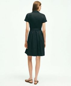 Introducing the ultimate wardrobe essential: the Belted Shirt Dress. Elevate your everyday style with its timeless design and versatile functionality. The pleated bodice and skirt add a touch of sophistication to the classic shirt dress silhouette, while the forward point collar and elongated neckline exude understated elegance. Plus, with the addition of side-seam pockets, this dress seamlessly combines fashion and function. Crafted from 100% cotton, this dress is not only effortlessly chic but Elegant Daywear Dresses With Fitted Waist, Chic Box Pleat Pleated Dress For Work, Chic Workwear Pleated Dress With Box Pleat, Chic Workwear Dress With Box Pleat, Classic A-line Midi Dress With Pleated Waist, Classic Dress With Pleated Back, Classic Button-up Shirt Dress For Formal Occasions, Classic Fit And Flare Dress With Pleated Back, Fitted Box Pleat Midi Dress For Office