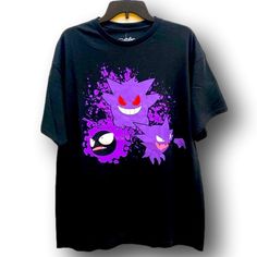 Graphic T-Shirt. Pokemon Gastly, Haunter, & Gengar Design. Size Extra Large Xl (Unisex). Pokemon & Hybrid Apparel Brands. Black Shirt With Purple, White, Black, Red, & Pink Colored Design. 100% Cotton. Brand New With Tags Attached. Perfect For Any Pokemon Fan! Purple Short Sleeve Tops For Fan Merchandise, Purple Short Sleeve T-shirt For Fans, Gengar Clothing, Pokemon Graphic, Pokemon Streetwear, Pokemon T Shirt, Pokemon Tshirt, Pikachu Shirt, Purple Crew Neck T-shirt With Character Print