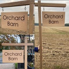 a wooden sign that says orchard barn and orchard barn