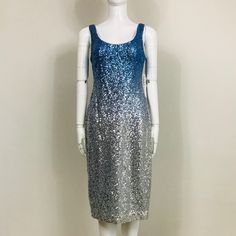 Nicole Miller New York Cocktail Dress Features Allover Metallic Sequin Ombr. Scoop Neckline; V Back. Sleeveless. Concealed Back Zip With Hook And Eye Closure. Sheath Silhouette. Hem Hits The Knee. Back Walking Vent. Color: Blue, Silver. Fabric: 100% Polyester. Lining: 100% Polyester. Size: 2. Measurements When Garment Laid Flat Approximately - Bust: 16.5", Waist: 14.5", Hips: 17.5", Length: 42". Nwt. Never Worn. Can Provide More Info And Pictures Upon Request. Spring Sleeveless Contrast Sequin Dress, Sleeveless Silver Sequin Dress For Party Season, Silver Sleeveless Sequin Evening Dress, Sleeveless Silver Sequin Evening Dress, Silver Sleeveless Sequin Dress For Evening, Blue Sleeveless Sequin Dress For Spring, Blue Sleeveless Dresses With Contrast Sequin, Blue Sleeveless Dress With Contrast Sequin, Metallic Sequin Sleeveless Evening Dress