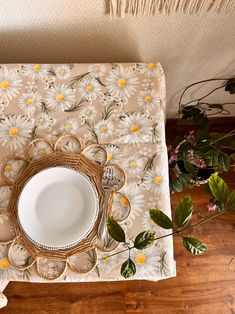 a place setting with flowers on the table