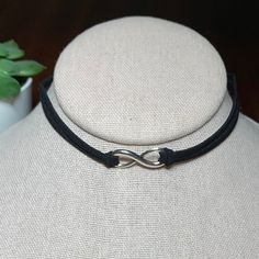 Black Suede Silver Tone Infinity Choker Necklace, 12.5”-14.25” On A 2 Strand Black Suede Cord With Lobster Clasp. Please See Photos For Details. Tags: Trendy, Modern, Goth, Punk, Emo Adjustable Nickel-free Infinity Necklace, Black Adjustable Infinity Jewelry, Black Sterling Silver Choker, Modern Goth, Infinity Necklace Silver, Silver Link Necklace, Pandora Necklace, Black Choker Necklace, Unicorn Necklace