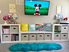 a child's playroom with toys and decor