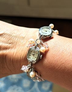 FUN! This is a bracelet made from vintage watches dating from the 1930s and up. There are a variety of watches used; this one includes Helbros 10k RGP, Cramers 17 jewel, Gruen Precision 17 jewel 10k RGP and Vail 10k RGP. I just love the different shapes of the watches! I've used pink faux pearls and pink crystals in this bracelet.  The bracelet measures about 1/2" wide and 7.25" long but can be shortened or lengthened to your specifications, simply send me a message. Each of my pieces are one of Classic Metal Watch Bands For Gifts, Antique Adjustable Jubilee Bracelet, Vintage Handmade Adjustable Watch Bands, Vintage Silver Metal Jewelry And Watches, Antique Silver Watch For Wedding, Antique Silver Watches For Wedding, Antique Silver Jewelry And Watches For Wedding, Timeless Metal Bracelets For Wedding, Adjustable Vintage Charm Jewelry For Anniversary