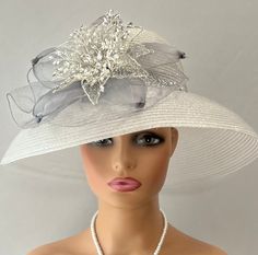 The featured hat is a  silver straw lightweight mesh hat.  The band around the hat is a bright sparkly silver bling strip. The hat is adorned with a  silver crinoline design. In the center of that design is a metal framed flower with wired clear rhinestones. The hat is so dramatic and evocatively romantic it's a must have for any woman who loves hats. Creating the look that suits you best comes from turning the hat on your head creating a different look with each twist till you find the look you love. This classic one of a kind hat made by Letty is a beautiful church hat or a Kentucky Derby Hat.   Also perfect  for  an Easter Hat, Tea Party hat,Wedding Party Hat, Fancy Dress hat, Downton Abby Hat and other special occasions. Brim:   6.5"" curved Rise:   4" Size:    Internal Draw String to Audrey Hepburn Hat, Unusual Hats, Hat Tea Party, Easter Hat, Downton Abby, Easter Hats, Hat Wedding, Church Hat, Tea Party Hats