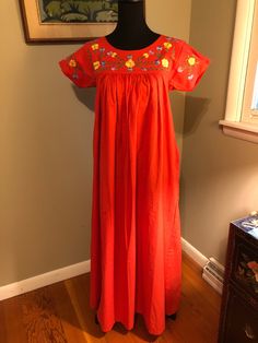 I am offering a 1970s Bloomingdales red cotton peasant dress. This dress has a floral embroidered yoke with gussets and short sleeves. The body of the dress is gathered and is floor length. It is marked as a size small. Measurements on request. Red Smock Dress For Spring, Spring Peasant Dress With Short Sleeves, Red Cotton Smock Dress, Red Smock Cotton Dress, Spring Peasant Short Sleeve Dress, Spring Cotton Peasant Dress With Short Sleeves, Peasant Cotton Dress With Short Sleeves, Peasant Style Short Sleeve Spring Dress, Short Sleeve Cotton Peasant Dress