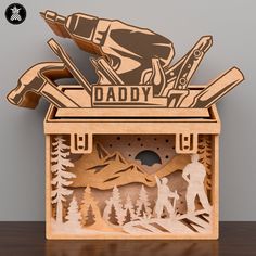 a wooden box that has some skis in it and the words daddy on it