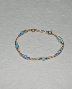 Simple and very elegant Sterling Silver bracelet with blue opal beads. This simple and beautiful piece of jewelry is perfect for a variety of outfits and occasions. M a t e r i a l s Your bracelet can be made of the following materials: Sterling Silver or 14k Gold Filled. Please select material during checkout process. M e a s u r e m e n t s - Available bracelet lengths: 6, 6.5, 7, 7.5, 8 inches - The length of the entire bracelet is measured from end to end - Model on the pics wears 7 inches b Male Body Jewelry, Opal Bracelet Gold, Opal Jewelry Necklace, Blue Opal Jewelry, Gold Bracelet Simple, Jewelry Opal, Black Lady, Silver Ring Designs, Jewelry Advice