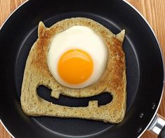 an egg in a toast with a smile drawn on it's face is shown