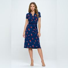 This Floral Tie Front Surplice Short Sleeve Dress Is A Versatile And Feminine Piece That Exudes Charm And Elegance. The Floral Print Adds A Touch Of Whimsy And Sophistication To The Overall Look. The Surplice Neckline Creates A Flattering Silhouette While Adding A Hint Of Allure. The Tie Front Detail At The Waist Accentuates Your Figure And Adds A Trendy Touch To The Dress. With Short Sleeves, This Dress Is Perfect For Staying Cool And Stylish During The Warm Seasons. Whether You're Attending A Fitted Midi Dress With Floral Print And Surplice Neckline, Blue Tie Waist Wrap Dress For Spring, Spring Blue Wrap Dress With Tie Waist, Blue Wrap Dress With Tie Waist For Spring, Fitted Floral Print Dress With Surplice Neckline, Floral Print Rayon Dress With Surplice Neckline, Knee-length Rayon Dress With Tie Waist, Fitted Midi Dress With Tie Waist, Fitted Blue Mid-length Dress