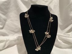 This 36-inch silver-tone chain is adorned with clusters of clear and white glass beads. A delicate and classically beautiful piece, it can be worn as a single long strand, or doubled. This necklace is in very good vintage condition, with some patina on clasp and chain. Truly timeless. Party Silver Long Necklace With Pearl Chain, Green Stone Necklace, Rhinestone Brooches, Green Stone, Jade Green, Glass Bead, Stone Necklace, White Glass, Long Necklace