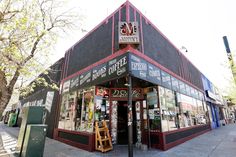 a store front with many signs on it