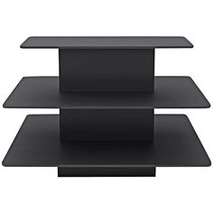 three black shelves are stacked on top of each other, with one shelf in the middle