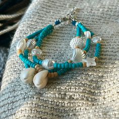 Embrace the Ocean Vibes with Our Ocean Breeze Beaded Bracelet Add a touch of seaside elegance to your look with the Ocean Breeze Beaded Bracelet from Ebandy Store. This handcrafted piece features a delicate arrangement of beads and shell accents, perfect for capturing the essence of the beach. 🔹 Handmade with Love: Each bracelet is meticulously crafted using high-quality beads in serene shades of turquoise and yellow, accented with delicate shell beads. The secure lobster clasp ensures easy wear and a comfortable fit. 🔹 Unique Design: Inspired by the beauty of the ocean, this bracelet combines the charm of the sea with elegant design. The multi-strand arrangement and shell accents make it a standout accessory that adds a touch of beachy vibes to any outfit. 🔹Standard Sizing: Designed to Beachy Vibes, Gift Bracelet, Ocean Vibes, Shades Of Turquoise, Ocean Breeze, Bracelets Handmade Beaded, Shell Beads, Bracelet Handmade, Multi Strand