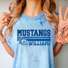 Show off at any Mustangs event with your new spirit wear. These tees and sweaters are great gifts for Mustang coaches, Mustang sports, Mustangs fans, teachers, elementary school PTA events, Mustang Moms, Dads and the whole Mustang family! You can customize the colors in the personalization section to reflect your favorite team r. It is trendy to size up 2 sizes for an oversized look or size down for a tighter fit.  To add a name (and or number) to the back of a shirt, add lounge pants, expedite Baseball Spirit Shirts, Gymnastics Spirit Wear, Elementary Shirt Designs, Pre-shrunk T-shirt For School Team Spirit, Casual T-shirt For School Football Season, Mustang School Spirit Shirts, Casual University Logo T-shirt For Sports Events, Blue School Tops With Team Name, Soccer Spirit Wear