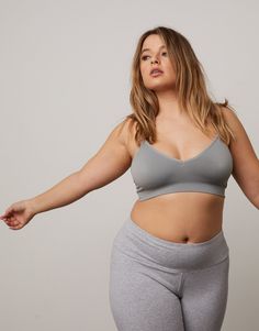 The Curve Padded V-Neck Bra is all about comfort. It comes in a variety of colors, white, black, and nude. Made from woven nylon material for a stretchy and comfortable fit. Features thin adjustable straps, v neckline, and lightly padded cups. Pair this underneath any oversize shirt and yoga leggings. Throw on a pair of sneakers and you're all ready to hit the gym for a great workout or a casual day running errands. It's also great to pair under sheer tops or deep necklines. Model is 5'6", bust Sheer Tops, Mid Size Fashion, Plus Size Sports Bras, Oversize Shirt, Deep Neckline, V Neckline, Sheer Top, Oversized T Shirt, Oversized Shirt