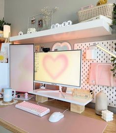 a desk with a computer monitor, keyboard and mouse on it in front of a shelf