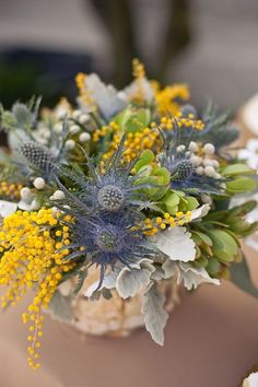 a bouquet of flowers sitting on top of a table