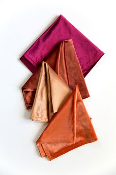 four folded napkins on top of each other