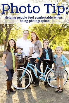 a group of people standing next to each other in front of a bike with the caption photo tips helping people feel comfortable when being photographed