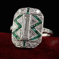 Antique Art Deco Cartier Old Baguette Diamond and Emerald Cocktail Ring For Sale at 1stDibs Antique Cartier Jewelry For Gifts, Vintage Cartier Diamond Jewelry, Formal Octagon Baguette Diamond Ring, Cartier Platinum Diamond Ring With Diamond Accents, Art Deco Platinum Jewelry With Baguette Diamonds, Art Deco Platinum Octagon Ring, Art Deco Octagon Platinum Ring, Cartier Wedding Diamond Ring With Diamond Cut, Cartier Platinum Ring In Diamond White