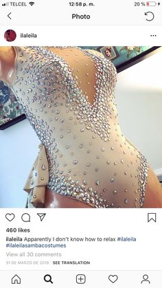 the back of a woman's dress with sequins on it