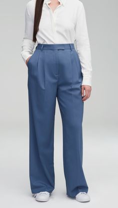 Our slouchy Pleated Trouser is a timeless piece that finds balance in touting both a wide-leg and a slim fit. The pant borrows from traditional suiting with a curtained waistband — which sits at the natural waistline for a flattering appearance — alongside pleated detailing. Womens Wool Pants, Pigeon Blue, Slim Blouse, Denim Vests, Belted Blazer, Linen Shop, Silk Charmeuse, Short Jumpsuit, Dress Suits