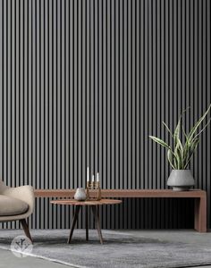 a chair and table in front of a wall with vertical stripes on the wall behind it