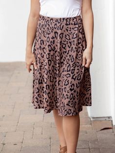 Hey there fashionista! Are you ready to take your summer wardrobe to the next level? Look no further than our Animal Print Laura Skirt! Not only is this skirt ultra-trendy with its eye-catching animal print, but it's also designed for maximum comfort and style. The A-line cut and extra flattering waistband will have you feeling confident and chic all day long. Size: Small 0-4 Medium 6-8 Large 10-12 XL 12-14 1X 14-16 2X 16-18 3X 18-20 Maxi Skirt Dress, Feeling Confident, Graphic Apparel, Knee Length Dresses, Hey There, Knee Length Skirt, Romper Pants, Blazer Dress, Flared Sleeves