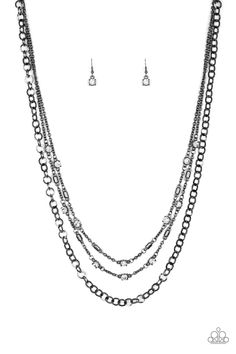 Dotted with glassy white rhinestones and glistening gunmetal accents, a collision of mismatched gunmetal chains layer down the chest for a refined flair. Features an adjustable clasp closure.

 Sold as one individual necklace. Includes one pair of matching earrings. Paparazzi Accessories Jewelry, Paparazzi Accessories, White Rhinestone, Black Necklace, Affordable Jewelry, Paparazzi Jewelry, Rhinestone Necklace, Necklace Earring Set, Matching Earrings