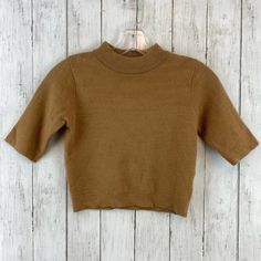 Princess Polly Brown Mock Neck Short Sleeve Cropped Sweater Size S/M 48% Viscose, 28% Polyester, 24% Spandex Pullover Mock Neck Short Sleeves Cropped Length Machine Wash Offers Accepted Bundle For Bigger Discounts ! Brown Stretch Turtleneck Tops, Casual Camel Top For Fall, Brown Knit Top For Layering, Brown Stretch Tops For Fall, Brown Knit Crew Neck Top, Casual Camel Tops For Spring, Camel Tops For Workwear In Fall, Brown Ribbed Collar Sweater For Spring, Brown Sweater With Ribbed Collar For Spring