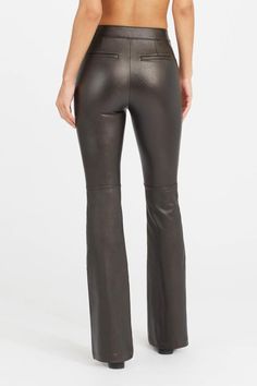 The Leather-Like Flare Pant is sure to be a new staple in your wardrobe. Leather-like fabric is more structured and gives you the look of a true leather pant with a chic flared leg. You won't just "like" them... you'll love them!Pull-on design for a completely smooth front​ Fitted through hip and thigh with a flare leg​ Comfortable stretch fabricHidden shaping panel flattens and tones tummy​ Bulk-free waistbandFace: 100% Polyurethane Coating. Back: 93% Polyester, 7% Elastane. Lining: 80% Polyest Toned Tummy, Knee Length Skirt Pencil, Flare Pant, Leather Pant, Muffin Top, Flare Pants, Perfect Outfit, Shapewear, Fashion Boutique