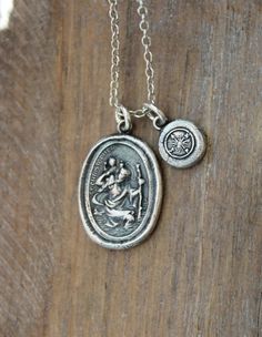 St.Christopher carrying the Christ Child on his shoulder - He is the patron Saint of travelers and a symbol of safe travel and protection. The charms are handmade by me from pure silver .999 -  the tiny compass is made from an antique seal,from the 1800's ~Made from recycled,eco friendly pure silver~ ~Given a patina,so the details stand out more~ ~Approx size: 2.0 x 1.4 cm - tiny compass: 0.8 cm~ ~Individually made by hand,so there may vary slightly from photos~ You may choose the charms with ju St Christopher Necklace, St Christopher, Saint Christopher, Patron Saints, Safe Travel, Jewelry Outfit, Jewelry Inspo, Sterling Silver Necklace, Jump Rings