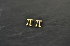 Pi Math Earrings, Pi Science Jewelry Stud Earrings, Geek Nerd Teacher Student Jewelry Gift, 14K Solid Gold This is a pair of a Pi stud earrings in 14K Solid Gold. Totally cute tiny earrings for a geeky style! Would make a perfect distinctive gift for someone special! Measurements approx.: 6.7mm Material: 14K Solid Gold Also check more --Earrings-- http://www.etsy.com/shop/HardResols?section_id=11614037 And my shop here: http://www.etsy.com/shop/HardResols >----REGISTERED MAIL WITH TRACKING NU Teacher Jewelry Gifts, Math Earrings, Nerd Earrings, Math Jewelry, Pi Math, Marvel Jewelry, Teacher Jewelry, Geeky Fashion, Science Jewelry